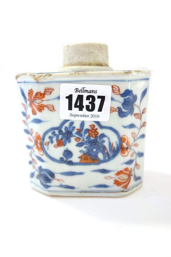 A Chinese Imari tea caddy, circa 1720-50,  of canted rectangular form, painted in underglaze-blue, iron-red and gilding with buildings and flowers, 10