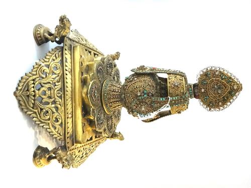 A Tibetan gilt-metal filigree altar vase, cover and stand, late 19th/20th century, the ornate urn set with turquoise and other hardstones, raised on a