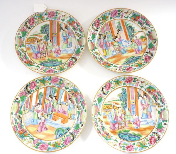 Four small Canton famille-rose plates, mid 19th century, each painted in the centre with a figurative scene, inside a border filled with flowers, frui
