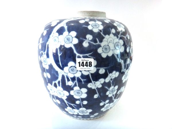 A Chinese blue and white oviform jar, late 19th century, painted with branches of prunus blossom against a `cracked-ice' ground, 27.5cm.high.