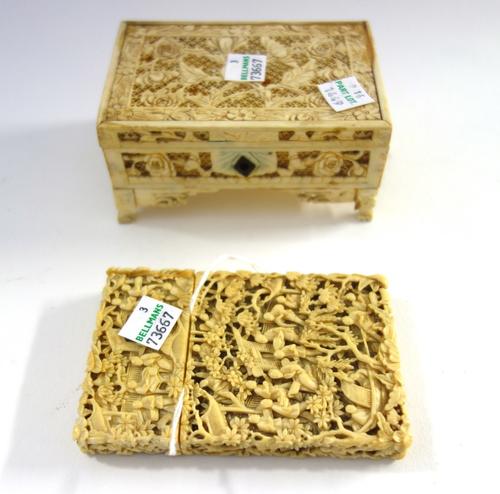 A Canton ivory rectangular card case, late 19th century, profusely carved with figures, pavilions and trees, (a.f), 10.5cm. high; and a small Canton i