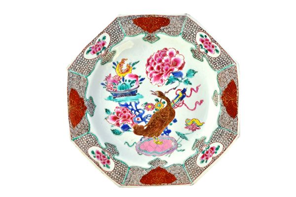 A set of six Chinese famille-rose plates, Yonzheng/early Qianlong, each painted with a duck standing amongst peony and auspicious symbols, inside a pa