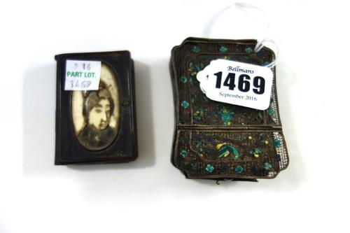 A small Chinese silver filigree and enamelled travelling vanity case, late 19th century, of shaped rectangular form, the hinged lid opening to reveal