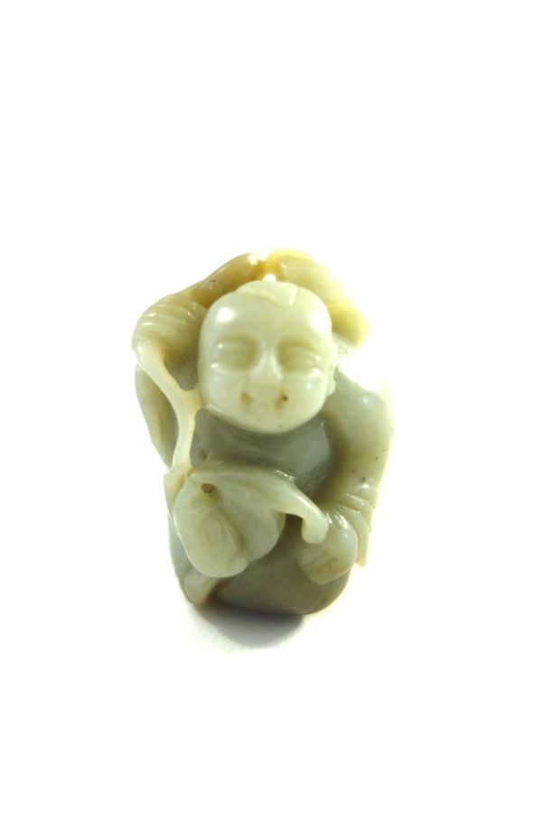 A celadon jade figure of a man, probably 19th century, carved squatting and carrying a string of coins across his shoulders, 4.5cm.high.