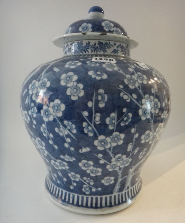A Chinese blue and white baluster vase and a cover, late 19th century, painted with prunus on a `cracked ice' ground, (a.f), 36cm. high.