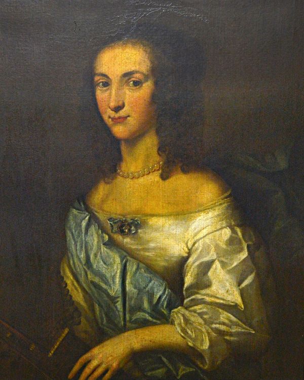 Follower of Adriaen Hanneman, Portrait of Mrs Mountney, holding a guitar, oil on canvas, inscribed, 71.5cm x 57.5cm.  IllustratedThe father of the sit