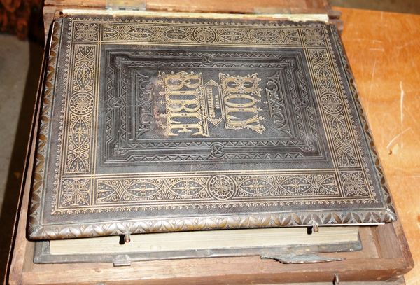 A 19th century metal bound Bible contained in a fitted studded pine box.