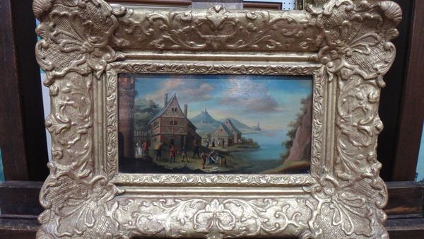 Continental School (18th century), A lakeside village scene with figures, oil on panel, 14cm x 27cm.