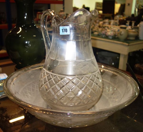 A heavy cut glass wash bowl and jug, (2).
