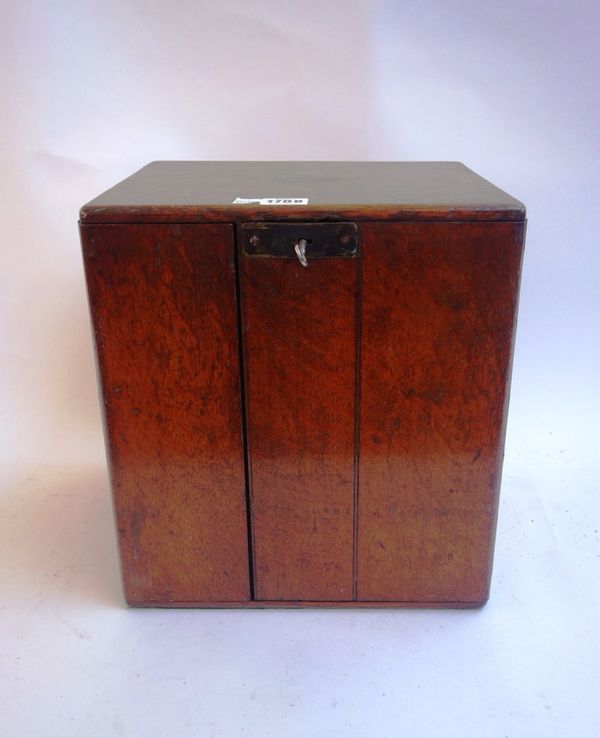 A Victorian oak cased table cabinet, the lockable drawer enclosing three drawers with side carrying handles, 30cm wide.
