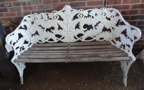A Coalbrookdale design white painted aluminium garden bench, in the 'Fern and Berry' pattern, with slatted wood seat, 150cm wide, together with a matc