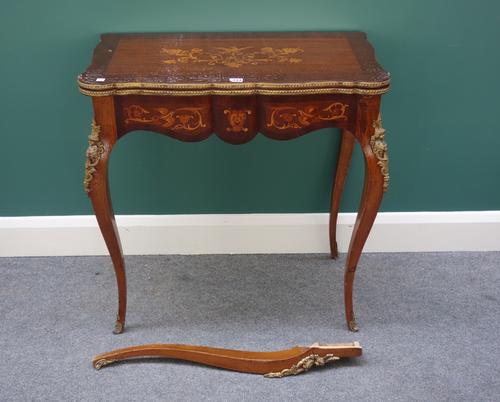 A late 19th century French marquetry inlaid gilt metal mounted mahogany card table, with serpentine top on cabriole supports, 74cm wide.