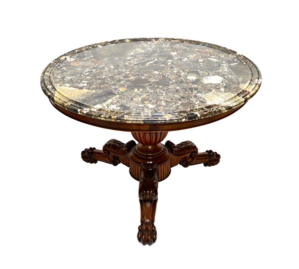 A Charles X French mahogany guéridon, the moulded circular marble top on a reeded baluster column and four lion paw supports, 100cm wide. Illustrated