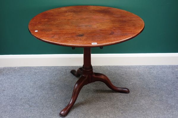 A mid-18th century mahogany occasional table, the circular snap top on bird cage mechanism and tripod base, 90cm wide.