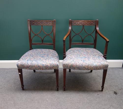 A set of six George III mahogany framed dining chairs, with interlaced splat back and bow seat, on tapering square supports. (6)