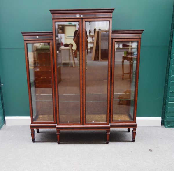 S & H Jewell; a Victorian inlaid rosewood glazed four door display cabinet, on tapering square supports, with brass maker's plaque "S & H Jewell 29,30