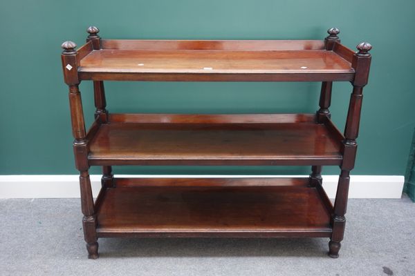 A Victorian mahogany three tier buffet, on tapering octagonal supports, 123cm wide.