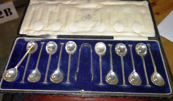 A cased set of twelve silver teaspoons and sugar tongs together with another cased plated canteen, (2).