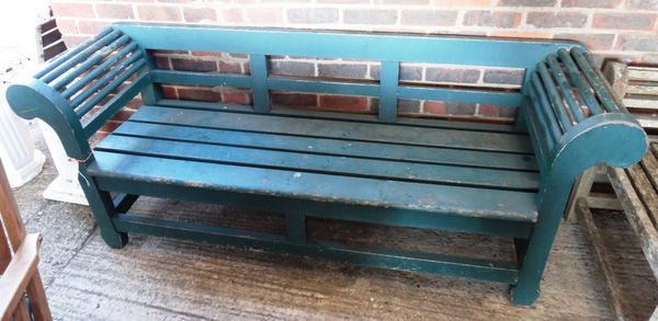 A 20th century green painted hardwood bench, with slatted seat, on block supports, 201cm wide.