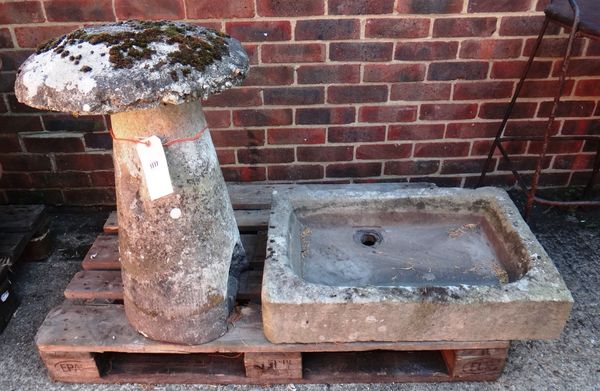 A staddle stone with a reconstituted top and carved stone conical column, 68cm high, together with a carved stone rectangular sink, 72cm x 48cm, (2).