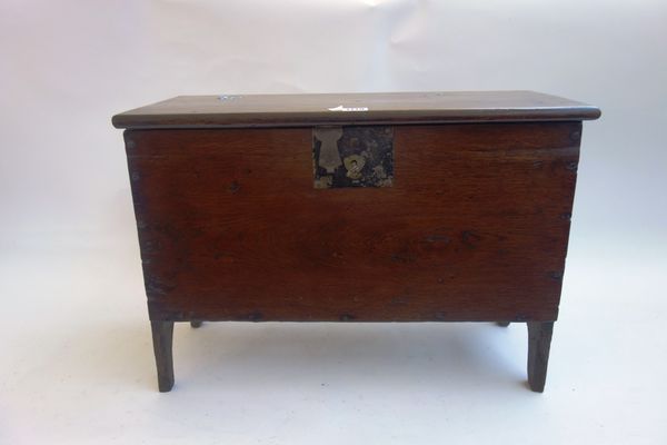 A small 17th century style oak five plank coffer, on slab end supports, 59cm wide