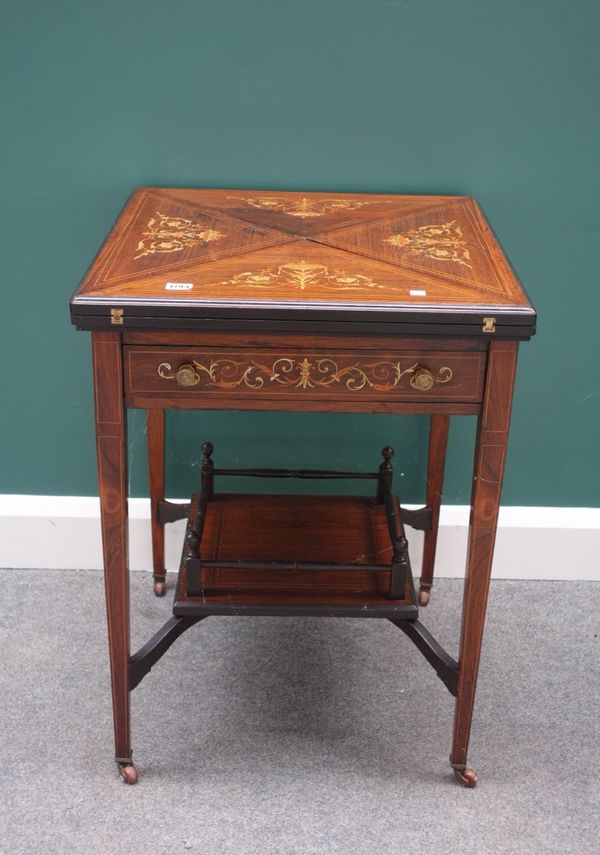 A late 19th century inlaid rosewood envelope card table, with single frieze drawer, on tapering square supports, united by platform undertier, 56cm wi