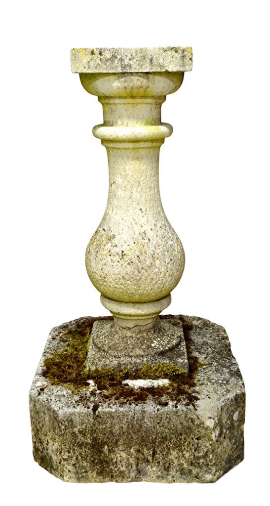 An early 20th century Georgian design baluster shaped carved Portland Stone sundial column, on canted square base, 115cm high. Illustrated