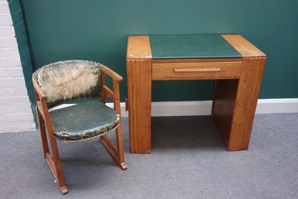 An Art Deco oak writing desk, with single frieze drawer, each pedestal with end cupboards, 90cm wide, together with a matching tub back chair, (2).