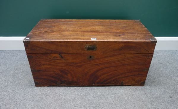 A 19th century metal bound rectangular camphor wood trunk, with side carrying handles, 85cm wide.