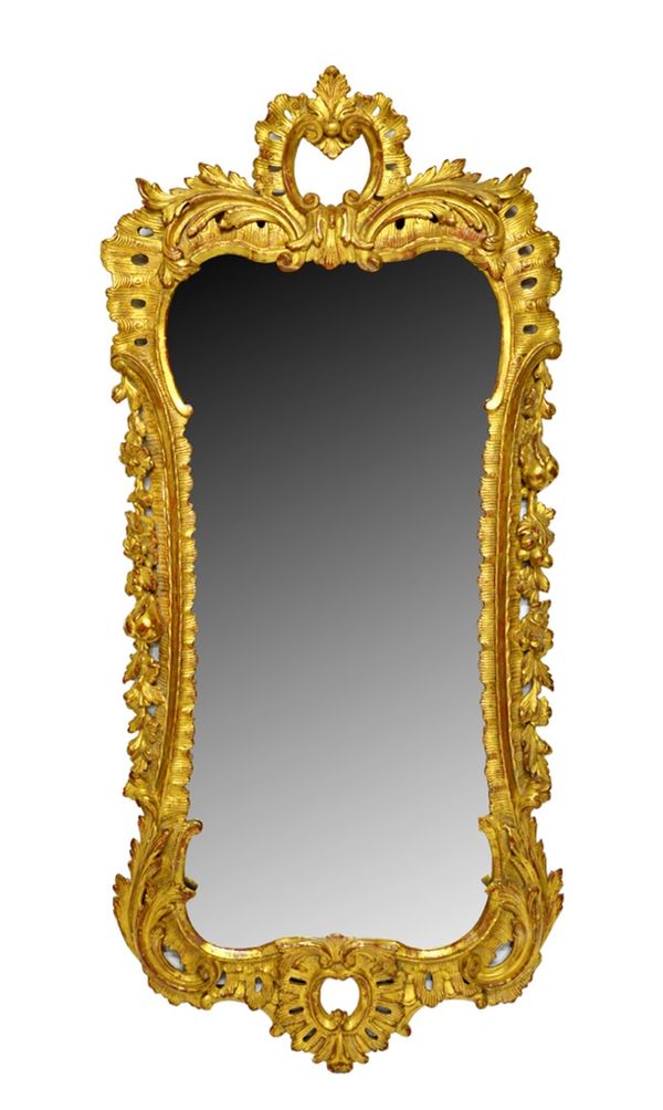 An early George III gilt framed wall mirror, with opposing 'C' scroll crest and lower frieze, about the floral chased shaped frame, 60cm x 135cm.