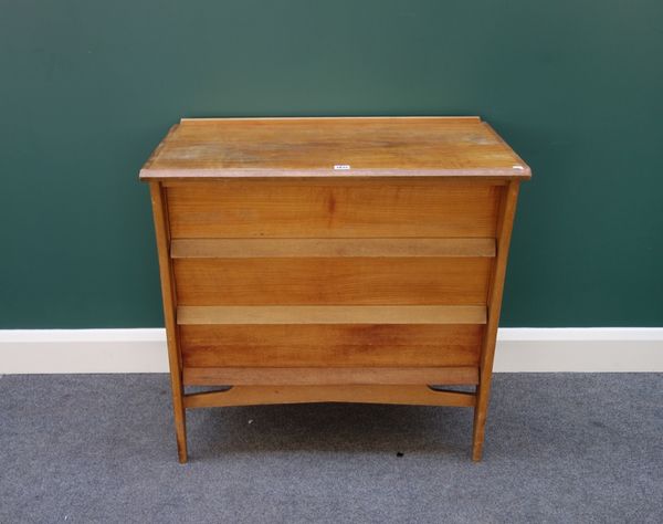 Heals; a 20th century birch three drawer chest on splayed supports, with ivory discs reading 'Heals, Tottenham Court Road, London W1'. 79cms wide