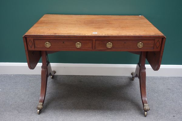 A Regency and later mahogany and rosewood banded sofa table, with pair of frieze drawers and dummy opposing, on four downswept supports, 101cm wide.