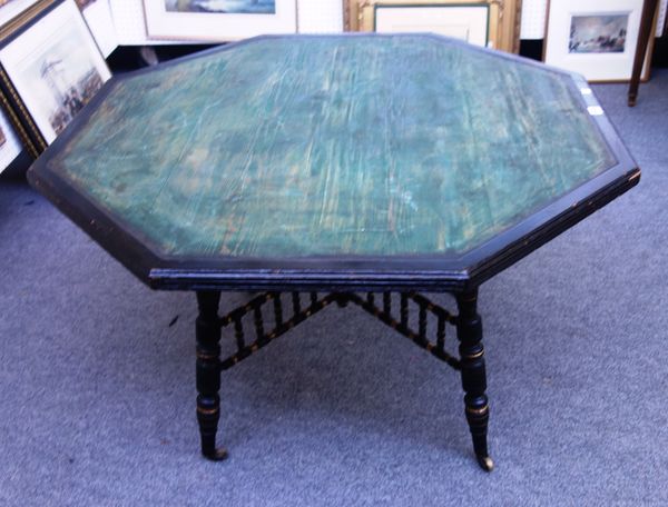 Howard & Sons; a 19th century parcel gilt ebonised octagonal centre table, on turned supports, stamped to the underside, 107cm wide.