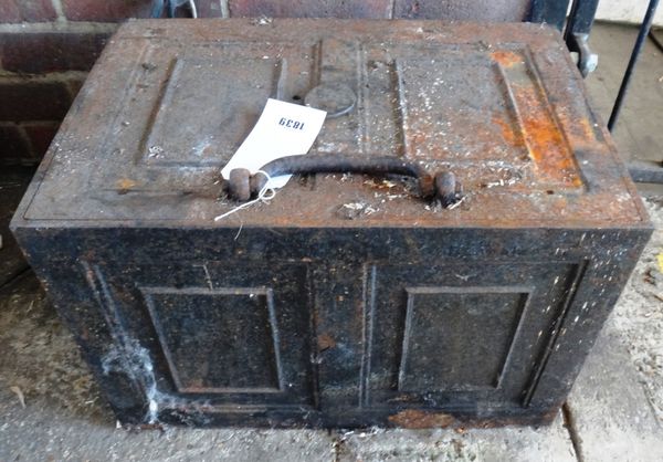 A cast iron strong box with key, 57cm wide.