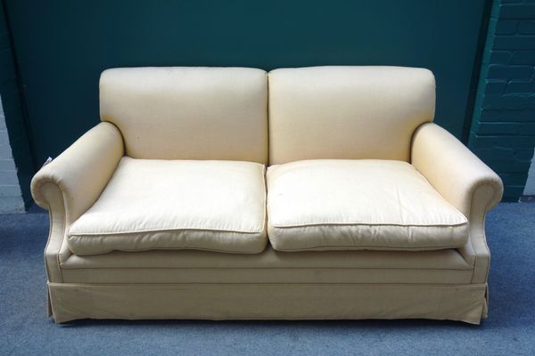 A 20th century mustard upholstered sofa, with scroll over arms, 180cm wide, together with six scatter cushions. (7)