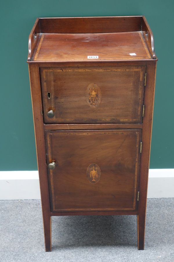 A George III inlaid mahogany night stand, the three quarter galleried top over two cupboards, on tapering square supports, 38cm wide.