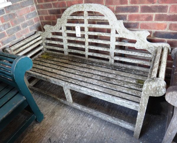 A 20th century hardwood garden bench of Lutyens design, 166cm wide.