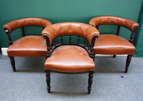 A matched set of three Victorian framed tub back chairs on square supports. (3)