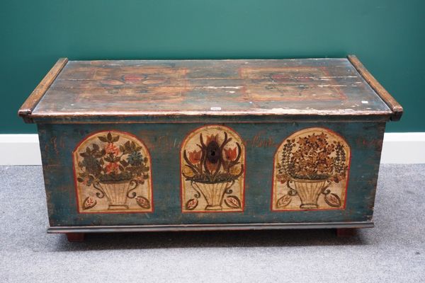 A 19th century Tyrolean polychrome painted rectangular pine trunk, with side carrying handles, 120cm wide.