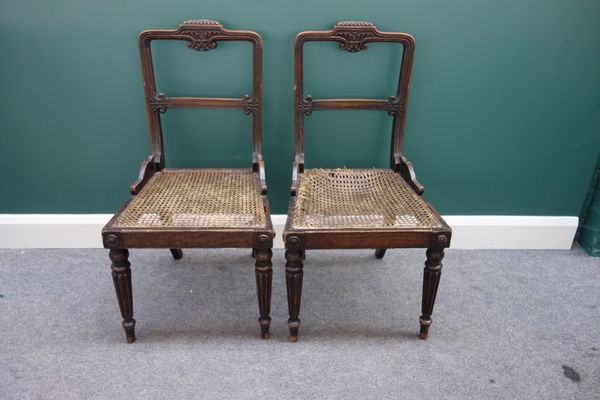 A set of six Regency faux rosewood dining chairs, each with carved crest rail and seat scroll mounts, on tapering reeded supports. (6)