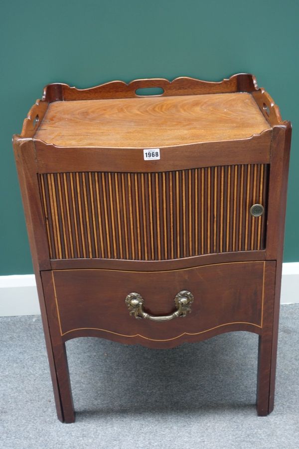 A mid-18th century mahogany night stand, the serpentine galleried top over a tambour panel and pull out drawer, 57cm wide.