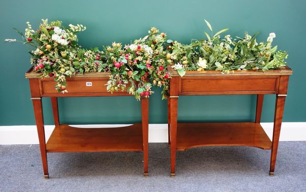 A pair of 20th century brass mounted rectangular fruitwood jardinières, each on tapering supports united by concave platform undertier. (2)