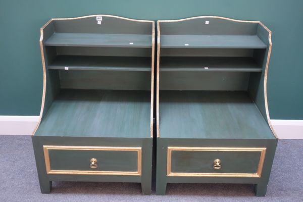 A pair of 18th century style parcel gilt green painted bedside tables, each with enclosed two tier backs over downswept sides and single drawer, on bl