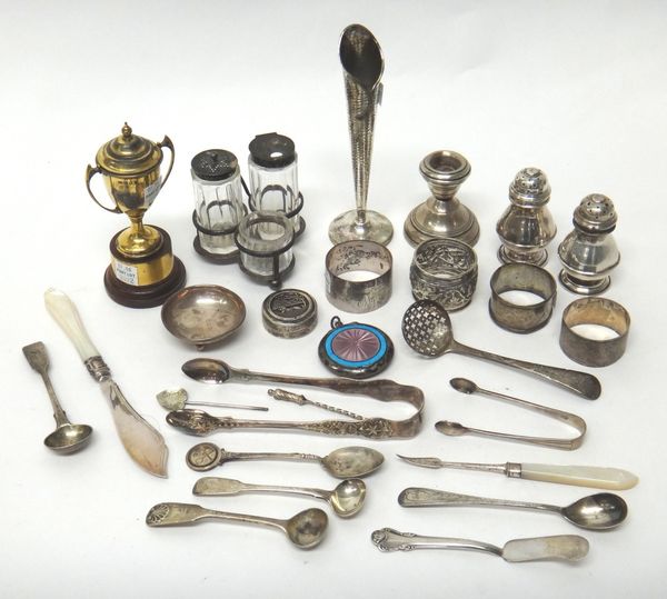 Mostly silver including a few foreign items, comprising; a condiment stand, London 1897, fitted with three glass condiments, a gilt twin handled troph