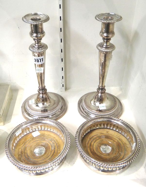 Sheffield plated wares, comprising; a pair of table candlesticks, probably by Matthew Boulton, each decorated with gadrooned rims and with a circular