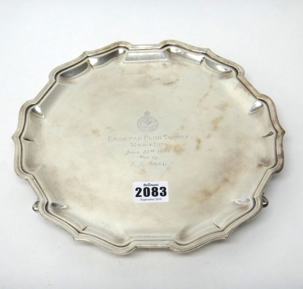 An Indian salver of shaped circular form in the Chippendale style, raised on three feet, presentation inscribed, retailed by Hamiltons Calcutta, diame