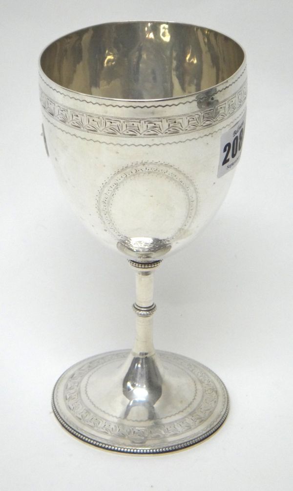 A Victorian silver trophy goblet, decorated with engraved borders and on a beaded circular foot, London 1862, height 18cms, weight 242gms.