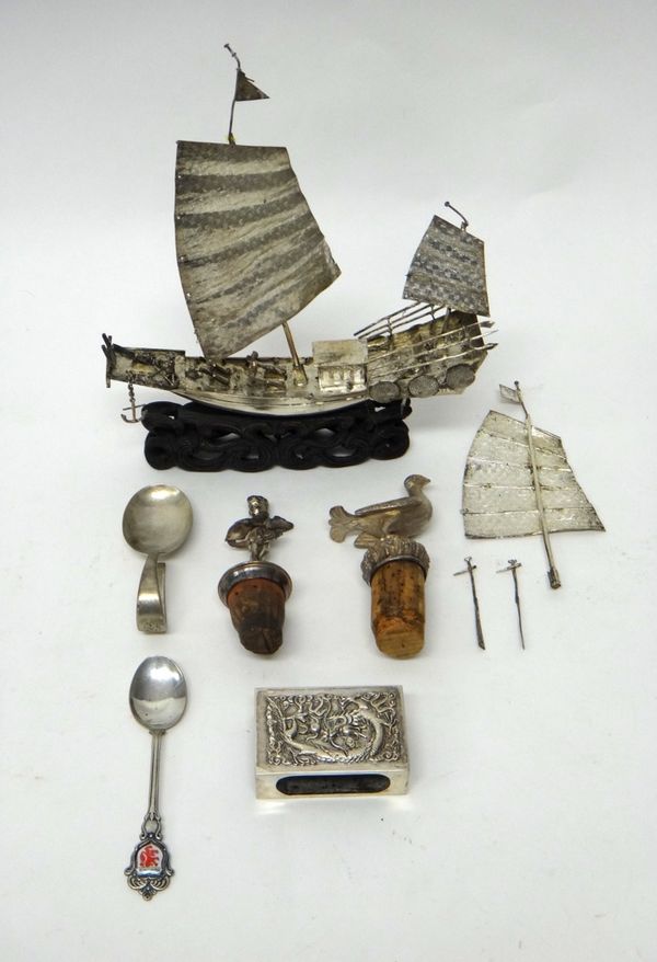 Foreign and plated wares, comprising; an Oriental model of a sailing junk, fitted to a carved wooden stand, a rectangular matchbox slide, decorated wi