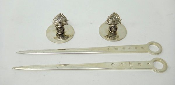 Silver, comprising; one Britannia Standard and one Sterling Standard skewer, each with a ring shaped handle, commemorating the millennium 2000, each 2