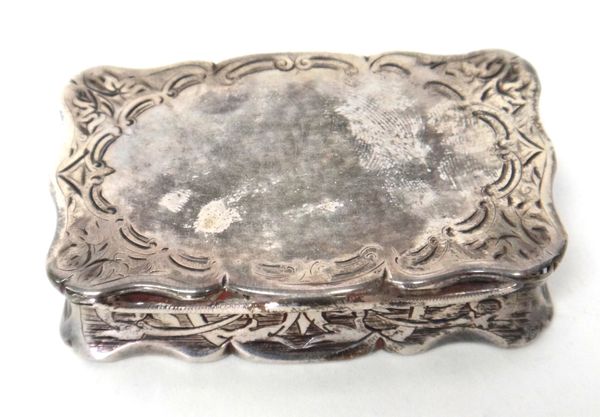 A Victorian silver snuff box by Hilliard & Thomason, of shaped rectangular form, having engraved decoration, Birmingham 1875, weight 61gms.